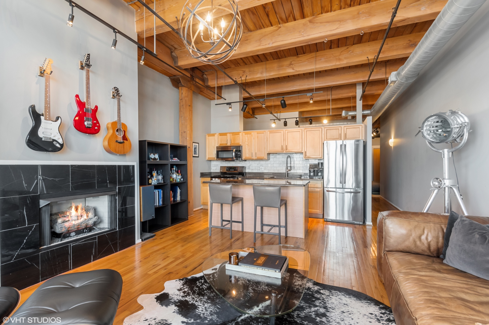 1250 West Van Buren Street, Unit 605 Chicago, IL 60607 - Photo 11 of 16 a kitchen with a refrigerator and a table