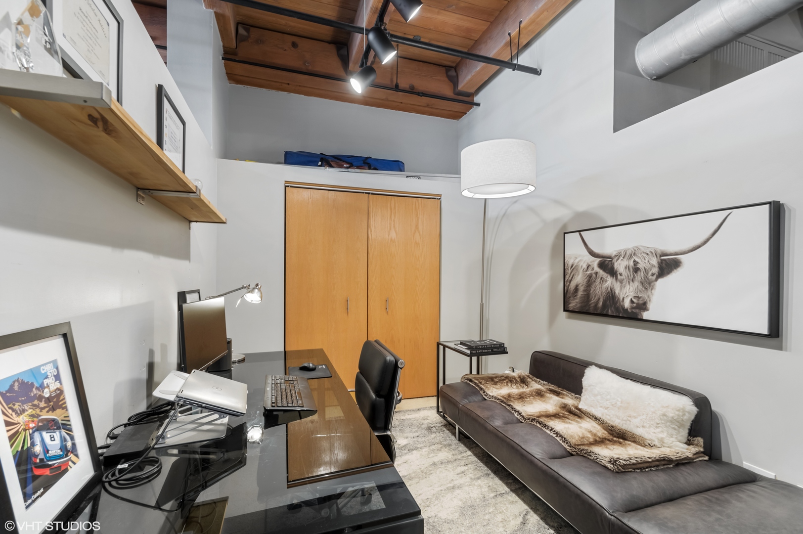 1250 West Van Buren Street, Unit 605 Chicago, IL 60607 - Photo 13 of 16 a living room with furniture and wooden floor