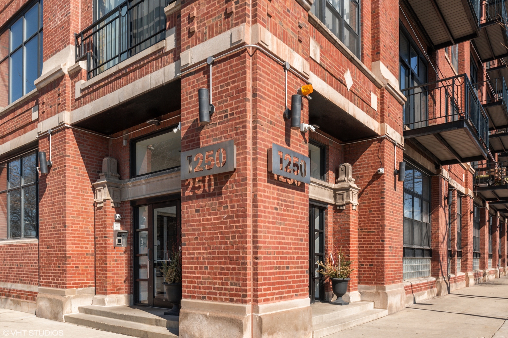 1250 West Van Buren Street, Unit 605 Chicago, IL 60607 - Photo 2 of 16 a tall building on a street