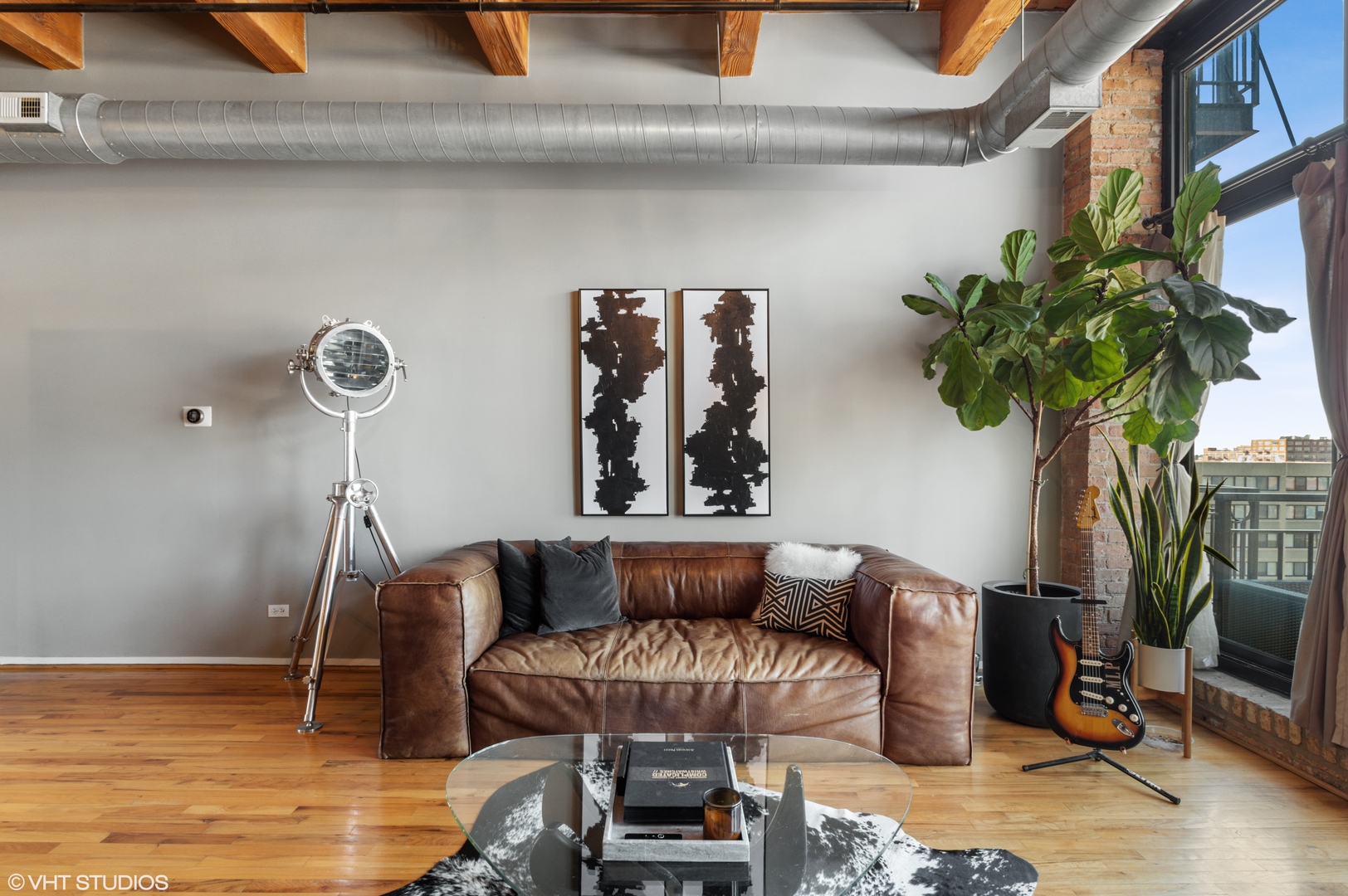 1250 West Van Buren Street, Unit 605 Chicago, IL 60607 - Photo 6 of 16 a living room with furniture