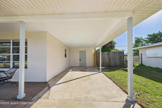 a backyard of a house with seating space