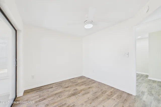 a view of an empty room with a large window