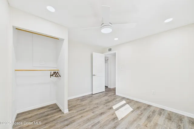 a view of empty room with floor to ceiling window
