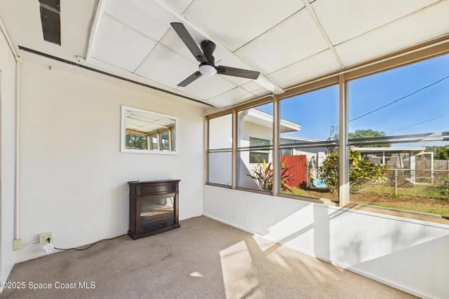 a view of empty room with windows