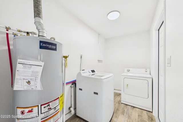 a kitchen with stainless steel appliances a stove sink and microwave