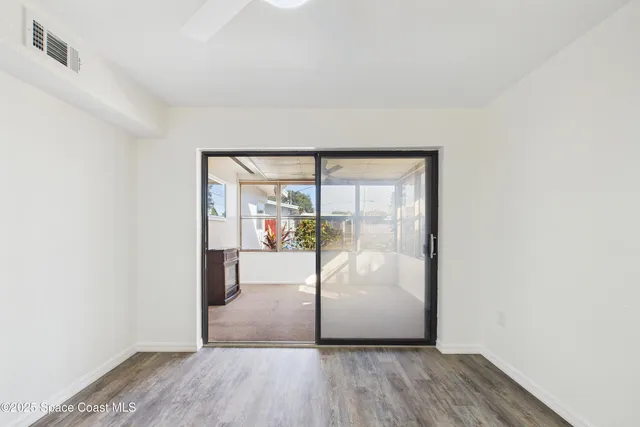 a view of a house with backyard and porch