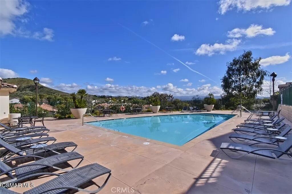 207 Morro Way, Unit 3 Simi Valley, CA 93065 - Photo 25 of 31 a view of a swimming pool and lounge chair