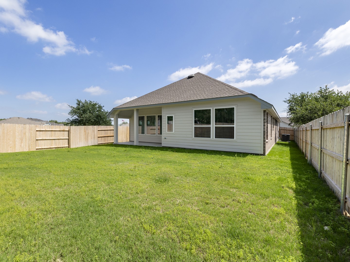 402 Judson Street Bertram, TX 78605 - Photo 23 of 27 a view of a house with backyard and garden