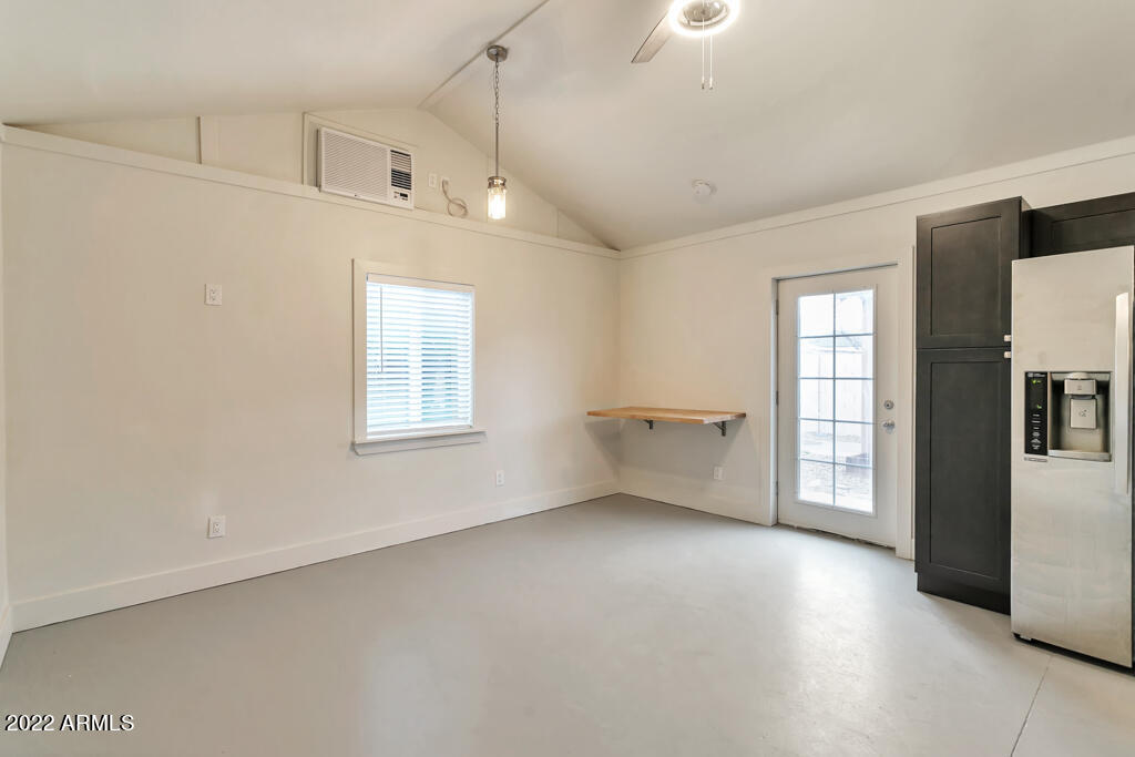 1638 East Granada Road, Unit B Phoenix, AZ 85006 - Photo 11 of 19 an empty room with windows and ceiling fan