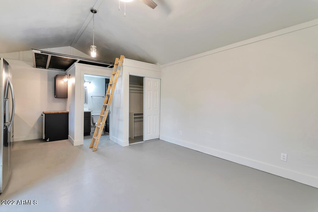 1638 East Granada Road, Unit B Phoenix, AZ 85006 - Photo 6 of 19 a view of a livingroom with a staircase