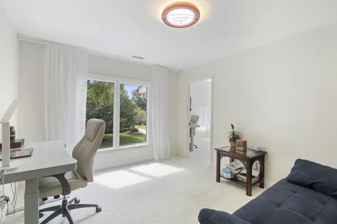 a bathroom with a sink mirror toilet and shower