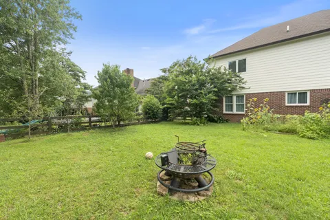 an aerial view of a house with a big yard