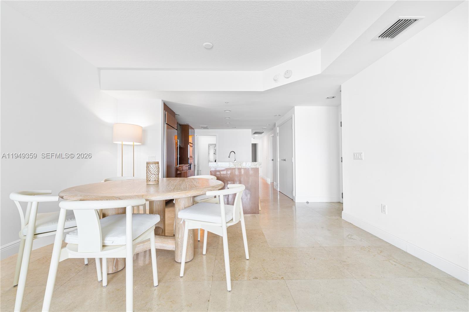 3801 Collins Avenue, Unit 1105 Miami Beach, FL 33140 - Photo 19 of 44 a dining room with furniture and window