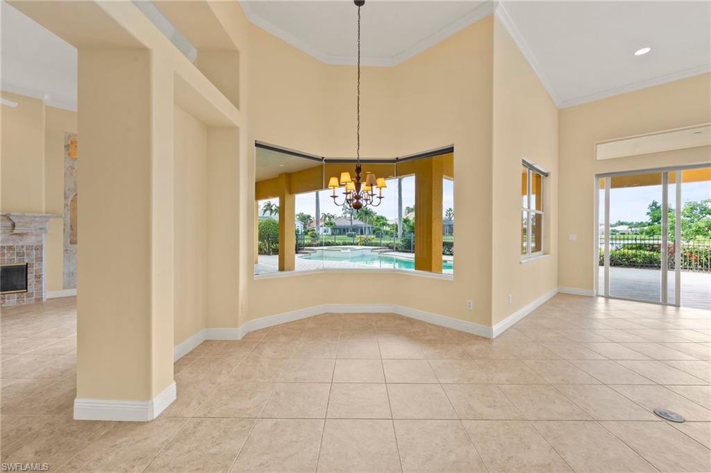 527 Terracina Way Naples, FL 34119 - Photo 22 of 48 a view of an empty room with a window