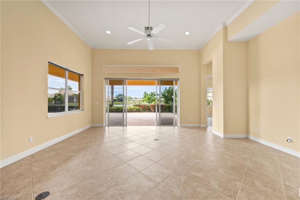 527 Terracina Way Naples, FL 34119 - Photo 23 of 48 a view of an empty room with a window