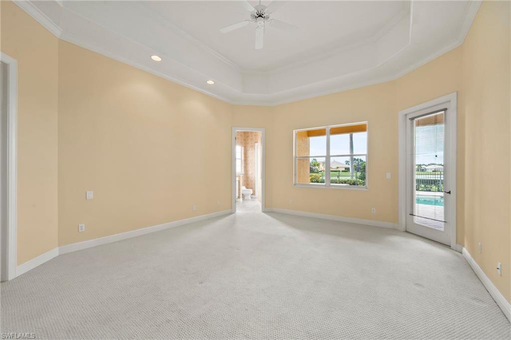 527 Terracina Way Naples, FL 34119 - Photo 25 of 48 an empty room with windows and closet