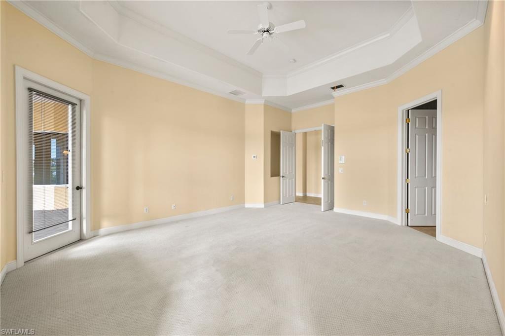 527 Terracina Way Naples, FL 34119 - Photo 26 of 48 a view of an empty room with a window