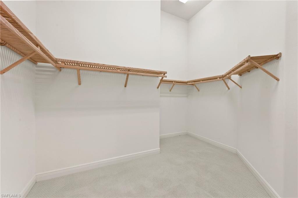 527 Terracina Way Naples, FL 34119 - Photo 29 of 48 a view of small space with racks on the wall