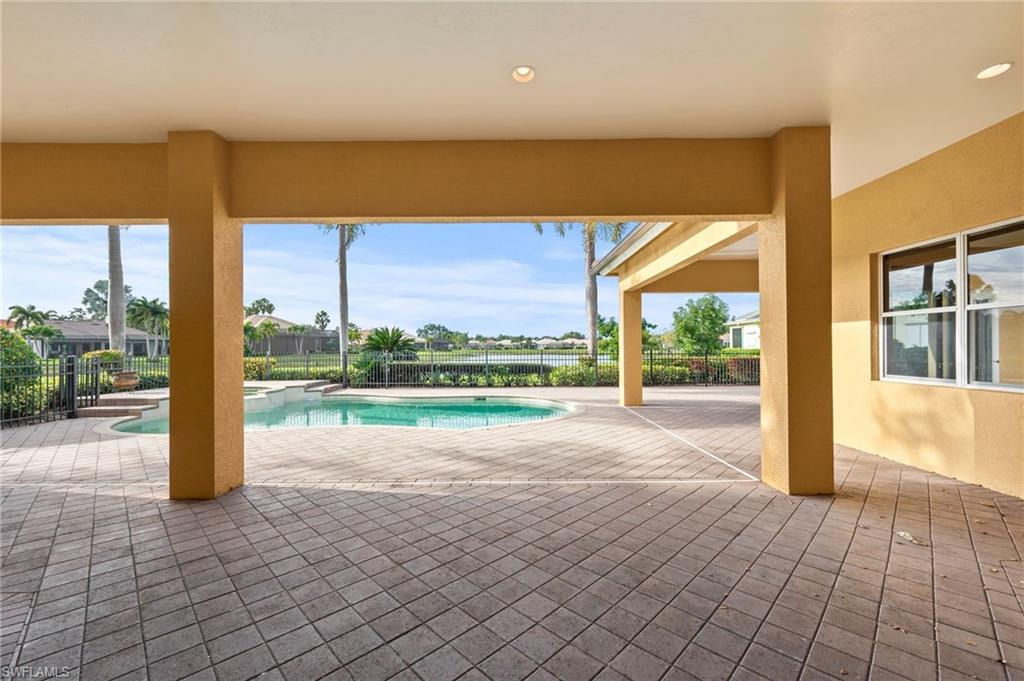 527 Terracina Way Naples, FL 34119 - Photo 40 of 48 a view of a swimming pool and outdoor space