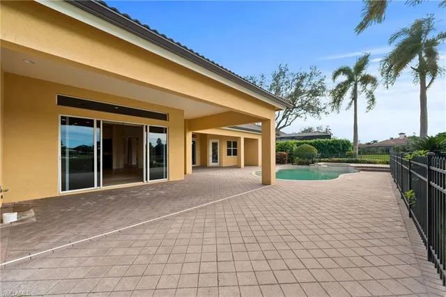 a view of a swimming pool with a lounge chair