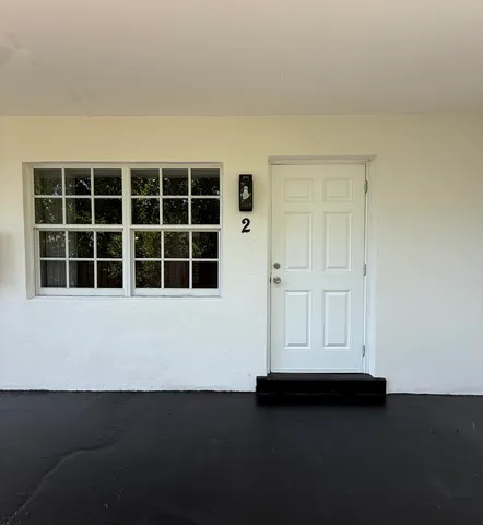 a view of empty room with windows