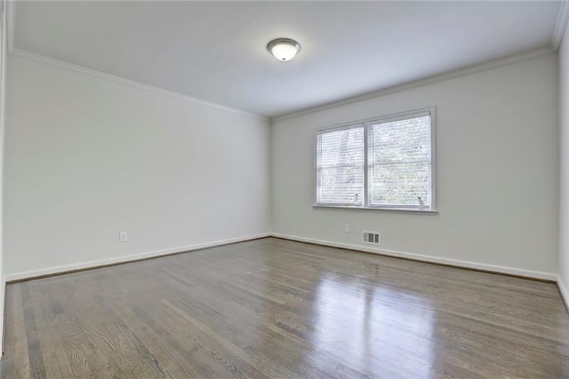 1195 Mt Paran Road Northwest Atlanta, GA 30327 - Photo 15 of 24 an empty room with wooden floor and windows