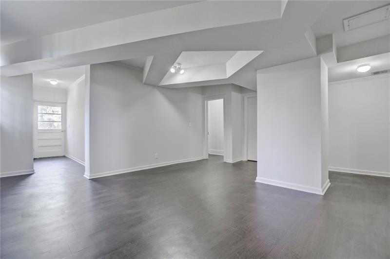 1195 Mt Paran Road Northwest Atlanta, GA 30327 - Photo 19 of 24 an empty room with wooden floor and windows