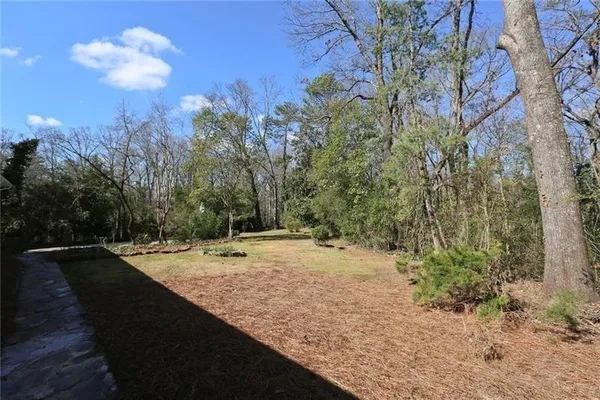 a view of a backyard of the house
