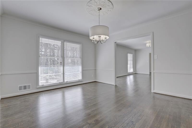 1195 Mt Paran Road Northwest Atlanta, GA 30327 - Photo 6 of 24 a view of an empty room with wooden floor and a window