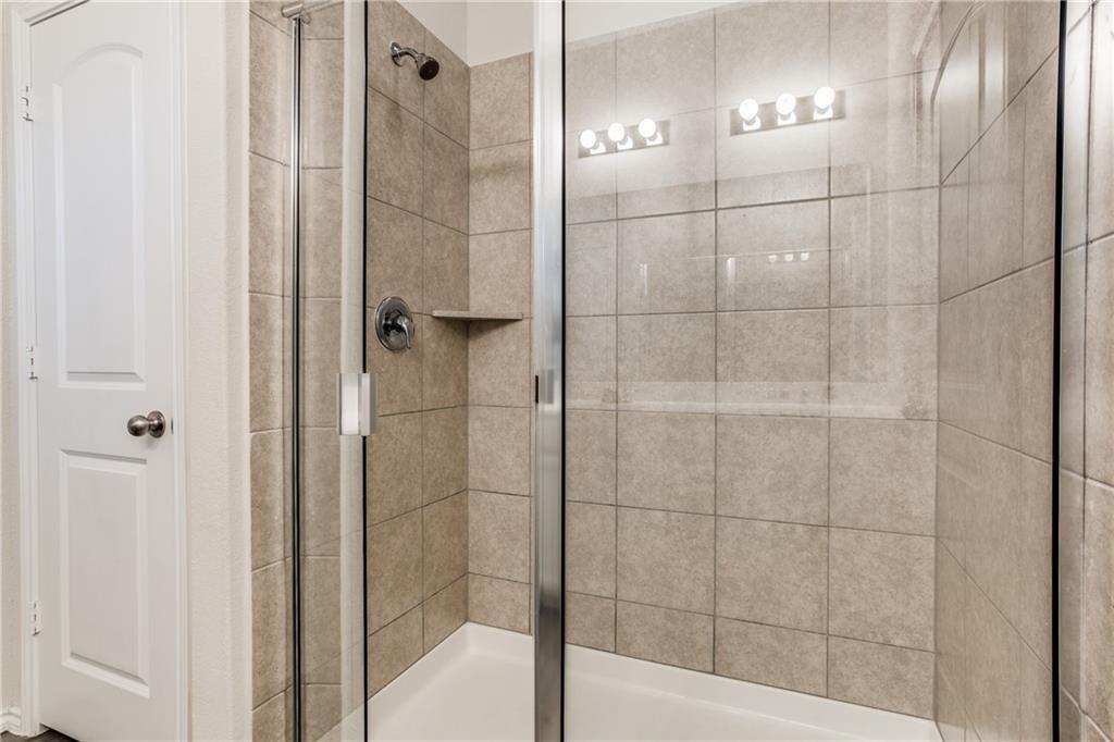 1413 Cliffbrake Way Georgetown, TX 78626 - Photo 18 of 30 a bathroom with a shower