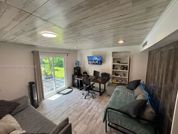 a living room with furniture and a window