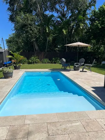 a view of a swimming pool with a patio