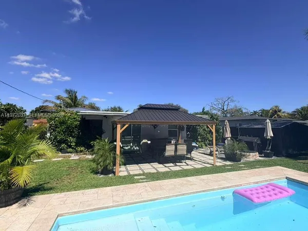 a front view of a house with yard