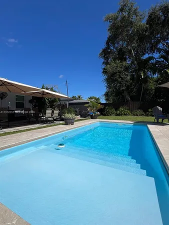 a view of outdoor space yard and swimming pool