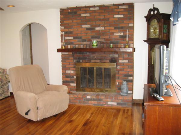 7 Gammons Road Acushnet, MA 02743 - Photo 13 of 20 a living room with furniture and a fireplace