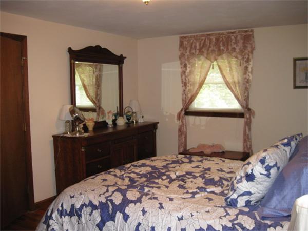 7 Gammons Road Acushnet, MA 02743 - Photo 18 of 20 a bedroom with a bed and a dresser