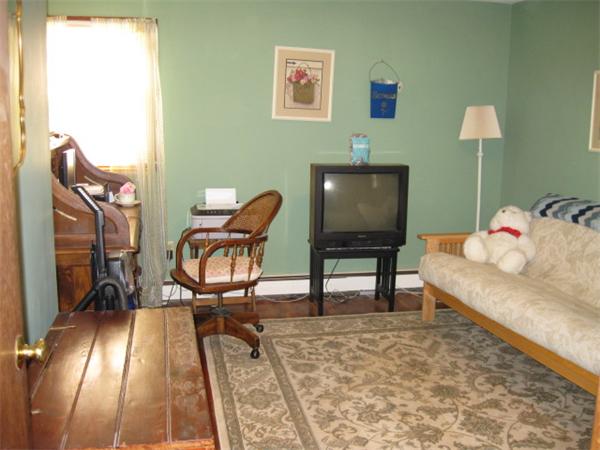 7 Gammons Road Acushnet, MA 02743 - Photo 20 of 20 a living room with furniture and a rug