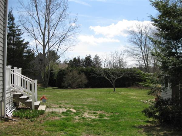 7 Gammons Road Acushnet, MA 02743 - Photo 5 of 20 a view of a garden with a house