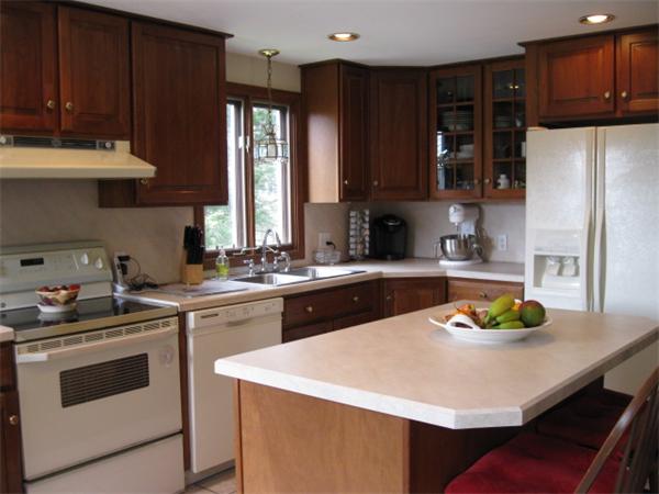 7 Gammons Road Acushnet, MA 02743 - Photo 9 of 20 a kitchen with a sink a stove and cabinets