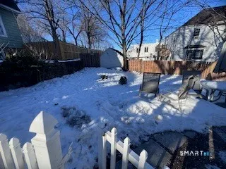 a view of backyard with outdoor seating