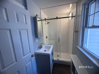 a bathroom with a shower and a tub
