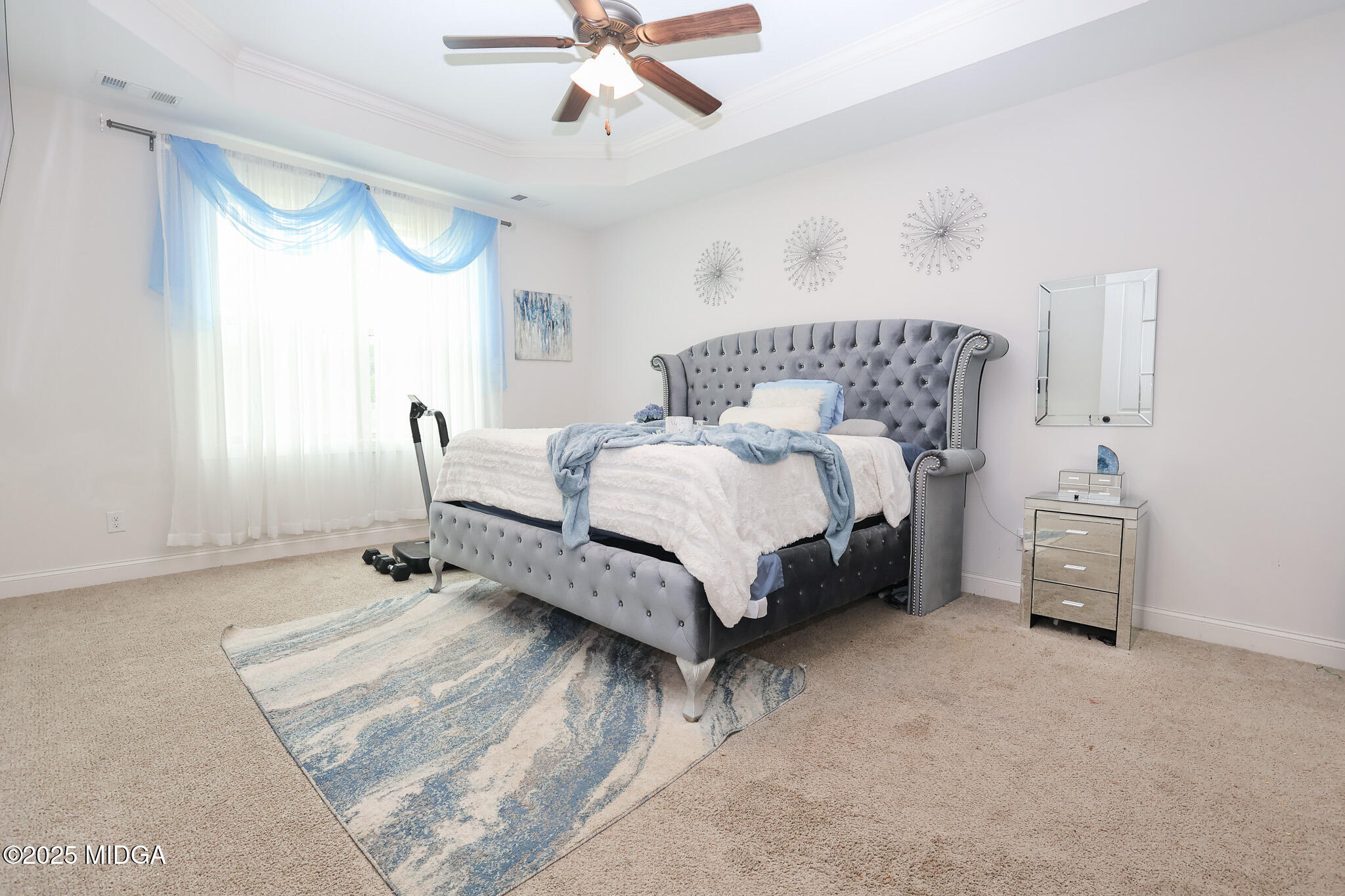 110 Gwendolyn Avenue Perry, GA 31069 - Photo 13 of 23 a spacious bedroom with a bed and a chandelier
