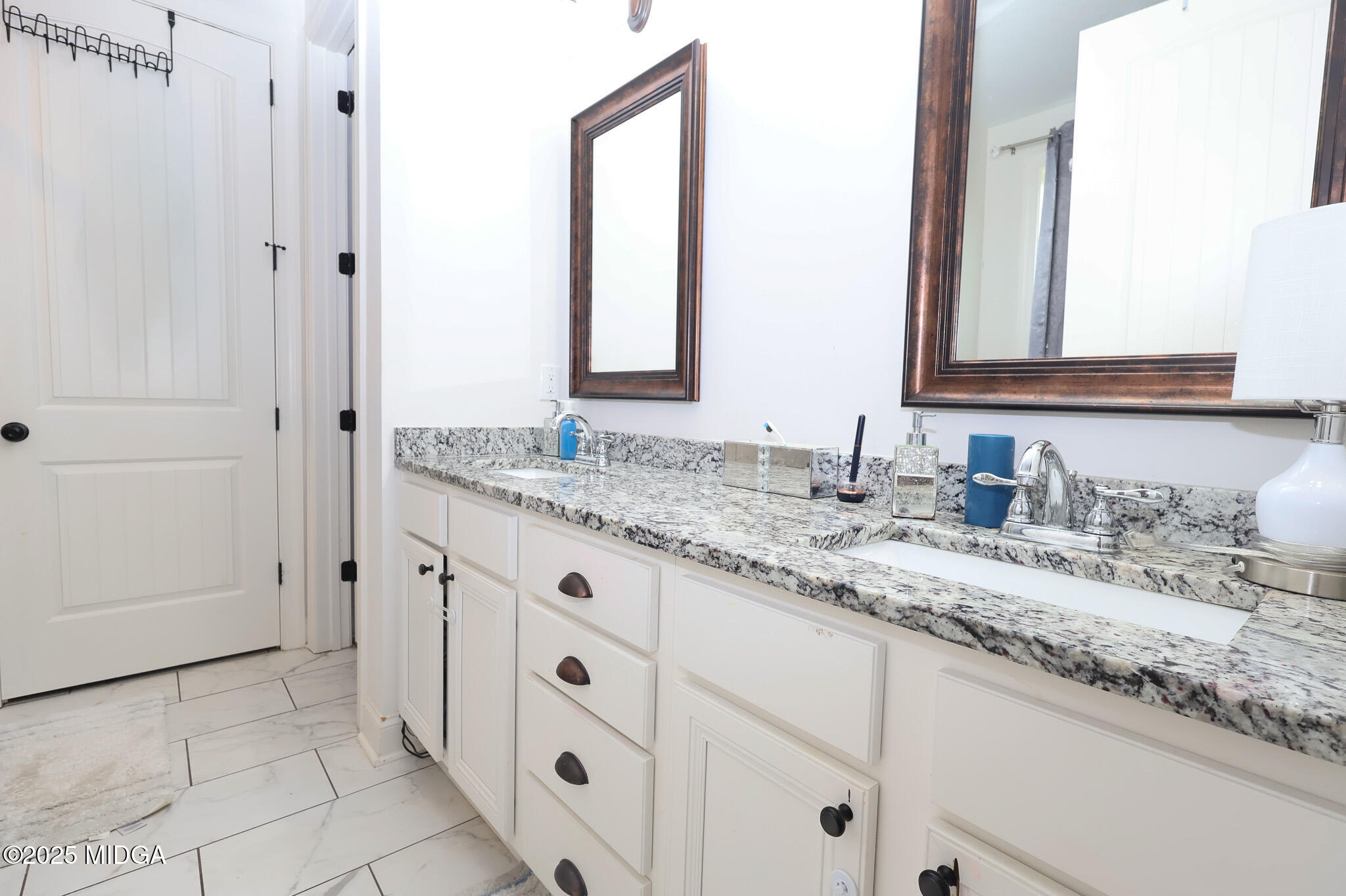 110 Gwendolyn Avenue Perry, GA 31069 - Photo 15 of 23 a bathroom with a granite countertop sink and a mirror