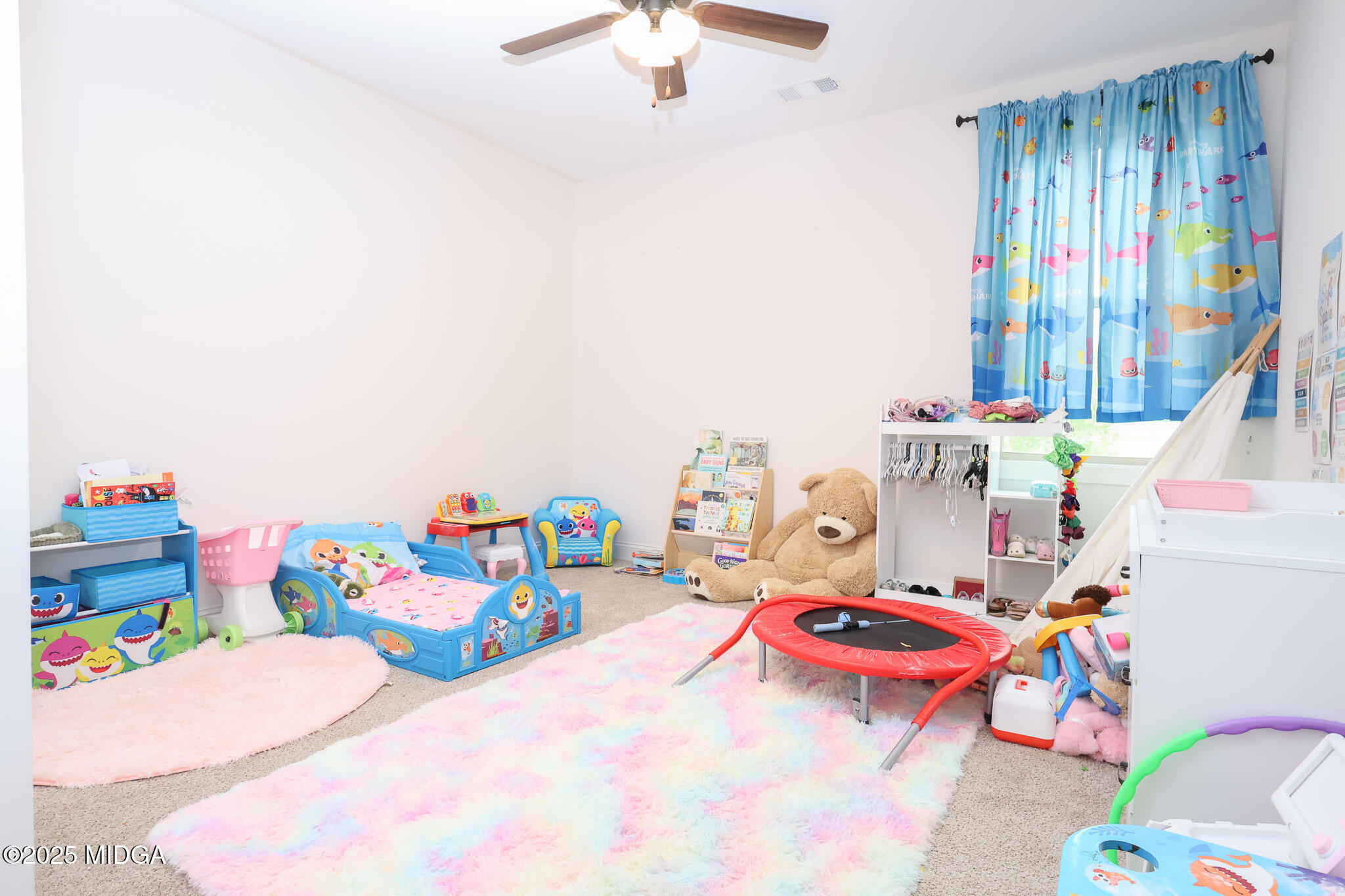 110 Gwendolyn Avenue Perry, GA 31069 - Photo 20 of 23 a bedroom with a bed and a chandelier