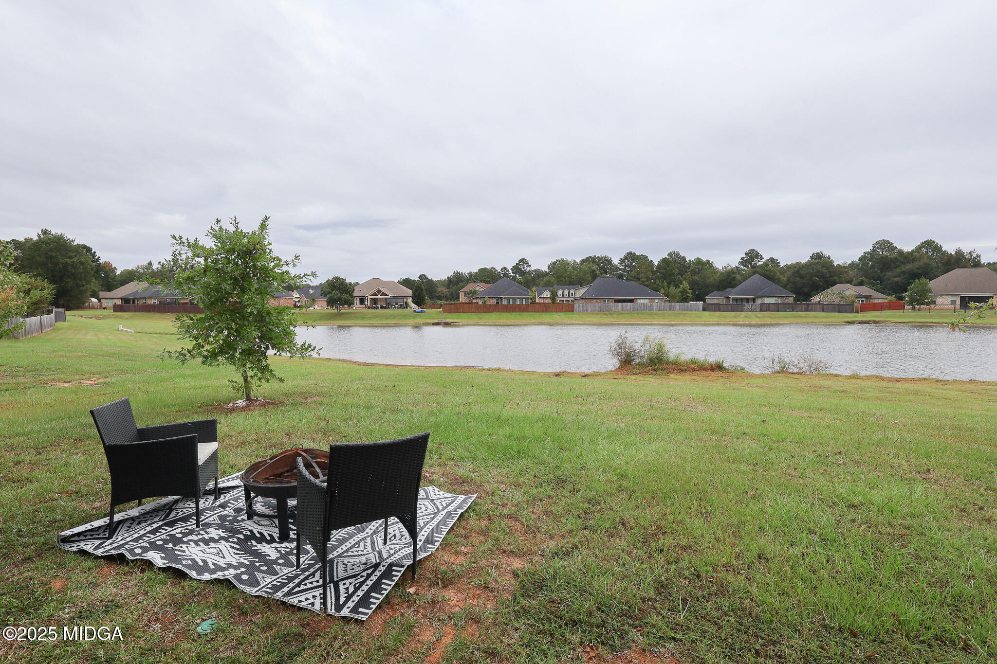 110 Gwendolyn Avenue Perry, GA 31069 - Photo 23 of 23 a view of a lake with a table and a chairs