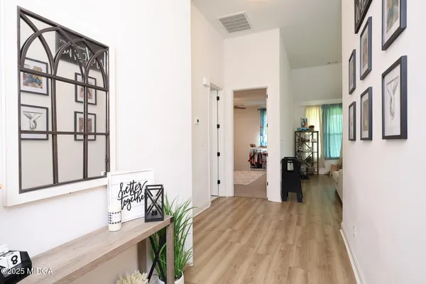 a view of a living room with a wooden floor