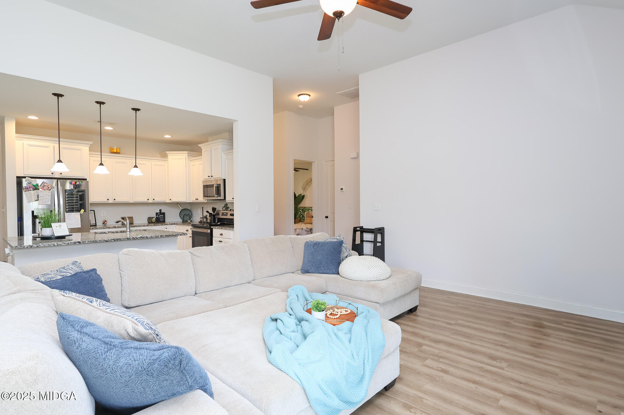 110 Gwendolyn Avenue Perry, GA 31069 - Photo 5 of 23 a living room with kitchen island furniture and a chandelier