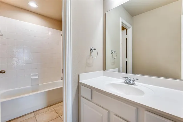 a bathroom with a sink and a bathtub