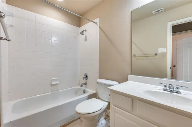 a bathroom with a sink a toilet and a bathtub