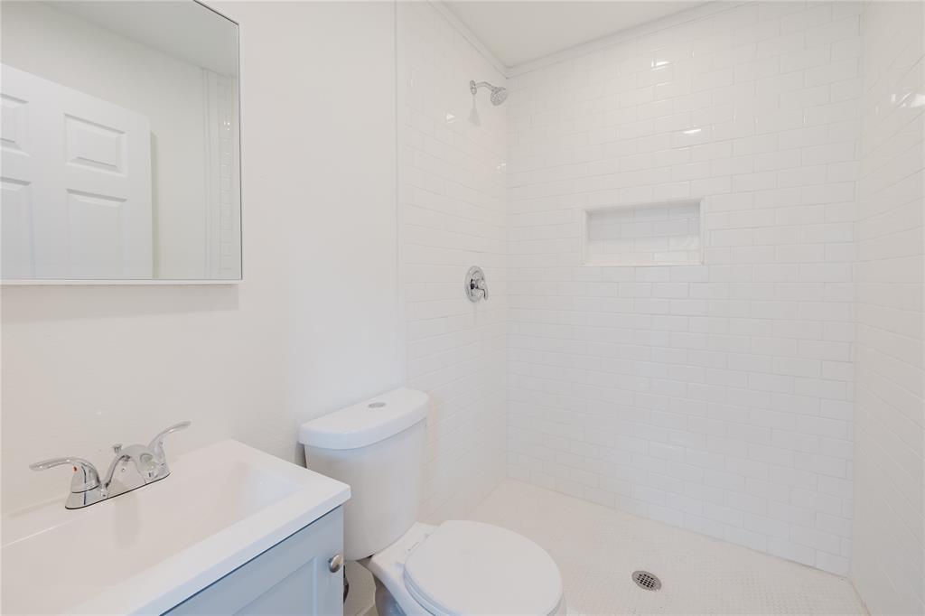 524 West Roberts Street Gorman, TX 76454 - Photo 28 of 35 a bathroom with a sink a toilet and shower